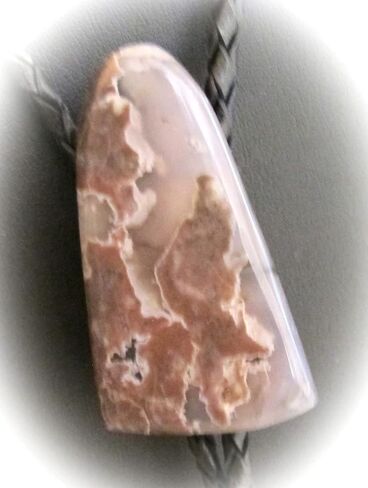 A Mauve and Gray Agate Is the Focus of this Bolo Tie With Black Leather Cord in Saudi Arabia