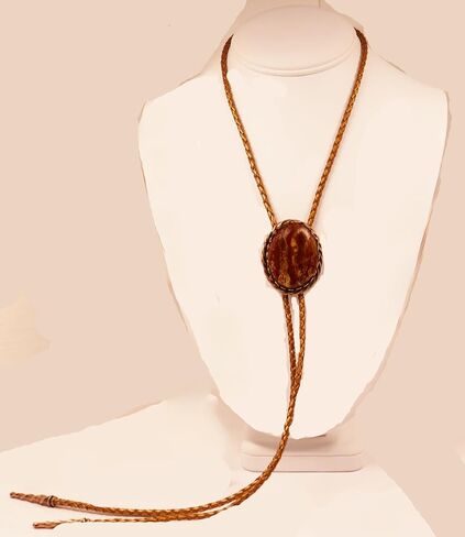A Deep Red and Gold Jasper Cabochon is in a Copper Tone Bolo Slide with Copprt Tone Leather Cord and Swirl Tips in Saudi Arabia