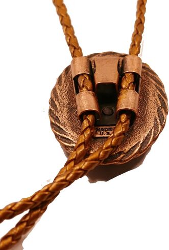 A Deep Red and Gold Jasper Cabochon is in a Copper Tone Bolo Slide with Copprt Tone Leather Cord and Swirl Tips in Saudi Arabia
