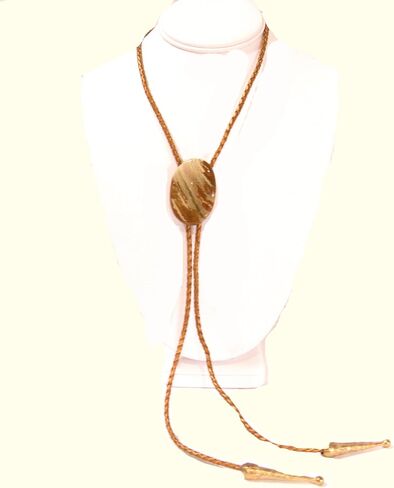 Cream and Medium Brown Streaked Jasper Is the Focus of This Bolo Tie with Metallic Indian Sun Cord and Gold-tone Traditionally Long Tips in Saudi Arabia