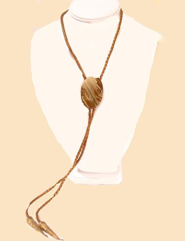 Cream and Medium Brown Streaked Jasper Is the Focus of This Bolo Tie with Metallic Indian Sun Cord and Gold-tone Traditionally Long Tips in Saudi Arabia