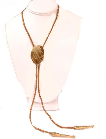 Cream and Medium Brown Streaked Jasper Is the Focus of This Bolo Tie with Metallic Indian Sun Cord and Gold-tone Traditionally Long Tips in Saudi Arabia