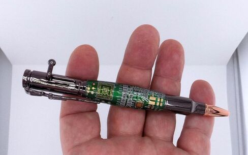 Handmade 30 Caliber Bolt Action Rifle themed ballpoint pen. Gunmetal Trim with Green circuit board body. in Saudi Arabia