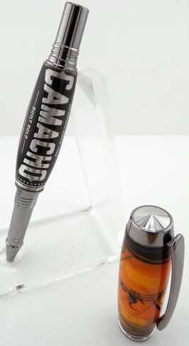 Handmade Artisan Jr Gentleman II style rollerball pen. Camacho cigar label collage in clear acrylic. Black titanium trim. Screw off postable cap. Black ink. in Saudi Arabia