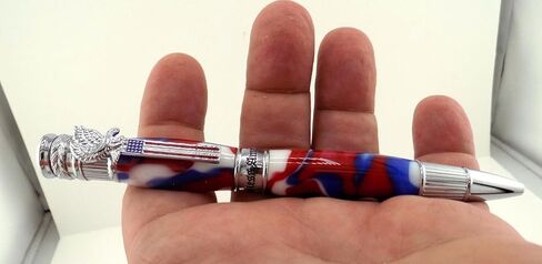 Handmade Patriotic themed ballpoint pen. Chrome trim. Red, white & blue acrylic. Twist to open. America on center band. USA on end cap. Eagle with flag pen clip. in Saudi Arabia