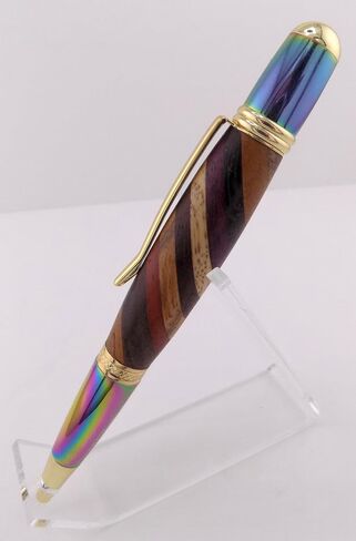 Handmade Sierra Mesa ballpoint pen. Layered hard woods. Metallic prismatic and gold trim. Black ink. in Saudi Arabia