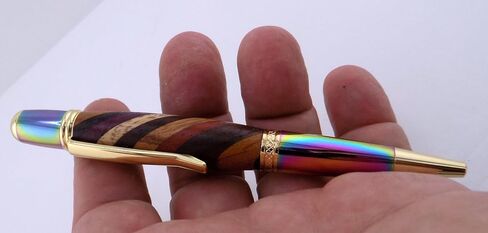 Handmade Sierra Mesa ballpoint pen. Layered hard woods. Metallic prismatic and gold trim. Black ink. in Saudi Arabia