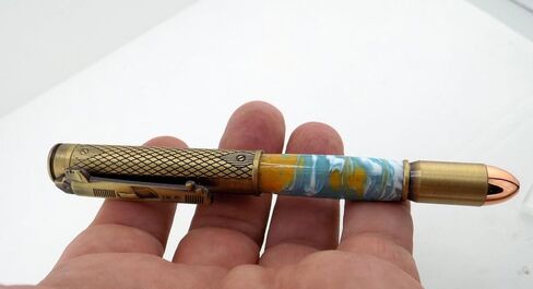 Handmade 45 Caliber themed ballpoint pen. Brass trim. Orange, blue and white acrylic. Clicks to open. in Saudi Arabia