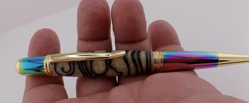 Handmade Sierra Mesa ballpoint pen. 3D printed Aztec design in cream acrylic. Metallic prismatic and gold trim. Black ink. in Saudi Arabia