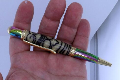 Handmade Sierra Mesa ballpoint pen. 3D printed Aztec design in cream acrylic. Metallic prismatic and gold trim. Black ink. in Saudi Arabia