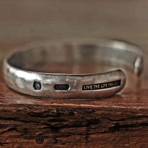 Steel punch imprinted memento mori silver cuff bracelet in Saudi Arabia