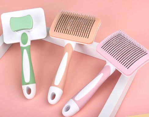 Self-cleaning sliding brush for dogs and cats, lightweight dog detangling brush for massaging and combing, cat brush gently removes undercoat in Saudi Arabia