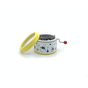 Esdemusica by Rocío hand made yellow music box. Exclusive design and a hand crank mechanism with the song: Gymnopedie by Satie. 1,9 inch x 1,5 inch high