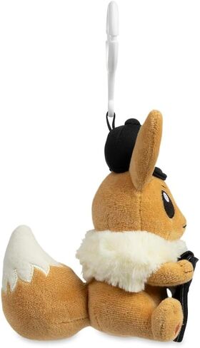 Pokémon Center TCG: سلسلة مفاتيح قطيفة لعرض العملات المعدنية من Eevee in Saudi Arabia