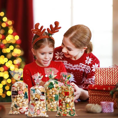 أكياس حلوى السيلوفان لعيد الميلاد من VToALARD 100 قطعة من أكياس حلوى عيد الميلاد لعيد الميلاد وأكياس هدايا بلاستيكية شفافة وأكياس حلوى البسكويت مع أربطة ملتوية لمستلزمات حفلات عيد الميلاد، مقاس 5 × 11 بوصة in Kuwait