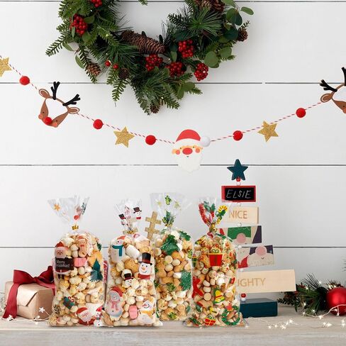 أكياس حلوى السيلوفان لعيد الميلاد من VToALARD 100 قطعة من أكياس حلوى عيد الميلاد لعيد الميلاد وأكياس هدايا بلاستيكية شفافة وأكياس حلوى البسكويت مع أربطة ملتوية لمستلزمات حفلات عيد الميلاد، مقاس 5 × 11 بوصة in Kuwait