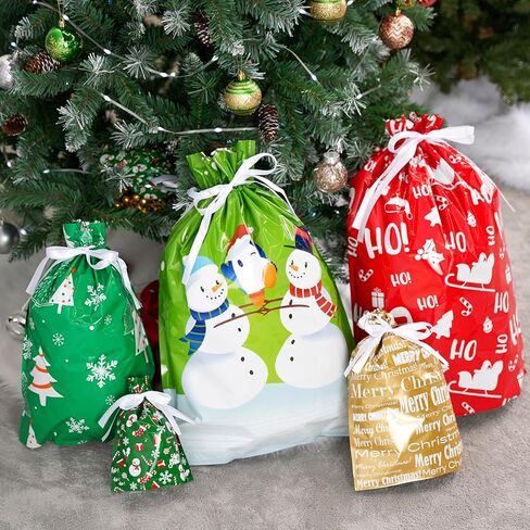 JOYIN 24 Pcs Christmas Drawstrings Foil Gift Bags, Xmas Wrapping Gift Assorted Styles Bag with present Tag for Christmas Holiday Party Favor, Reusable Wrap Goodie Bag Decorations in Saudi Arabia