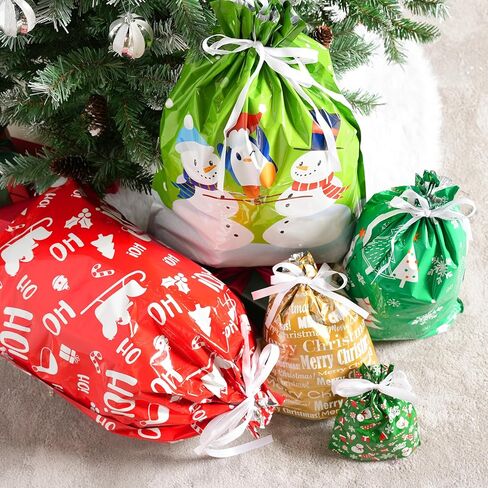 JOYIN 24 Pcs Christmas Drawstrings Foil Gift Bags, Xmas Wrapping Gift Assorted Styles Bag with present Tag for Christmas Holiday Party Favor, Reusable Wrap Goodie Bag Decorations in Saudi Arabia