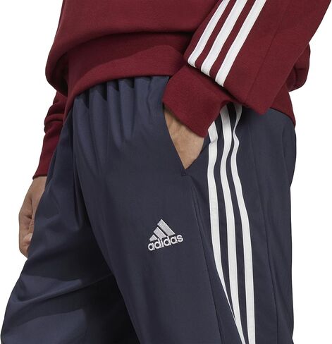 adidas Men's Aeroready Essentials Woven 3-Stripes Tapered Pants in Saudi Arabia