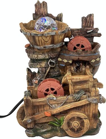 Tabletop Fountain Water Mill in Broken Jar on Cart in Saudi Arabia
