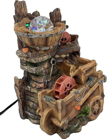 Tabletop Fountain Water Mill in Broken Jar on Cart in Saudi Arabia