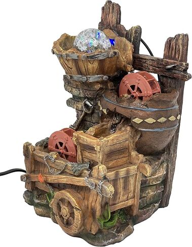 Tabletop Fountain Water Mill in Broken Jar on Cart in Saudi Arabia