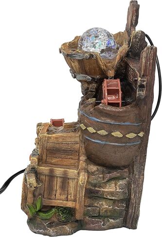 Tabletop Fountain Water Mill in Broken Jar on Cart in Saudi Arabia