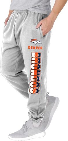 NFL Kids Youth 8-20 Officially Licensed Primary Team Logo Stripe Fleece Lined Football Sweatpants Joggers Pants in Saudi Arabia
