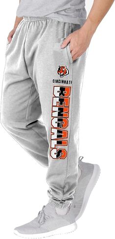 NFL Kids Youth 8-20 Officially Licensed Primary Team Logo Stripe Fleece Lined Football Sweatpants Joggers Pants in Saudi Arabia