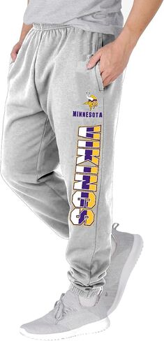 NFL Kids Youth 8-20 Officially Licensed Primary Team Logo Stripe Fleece Lined Football Sweatpants Joggers Pants in Saudi Arabia