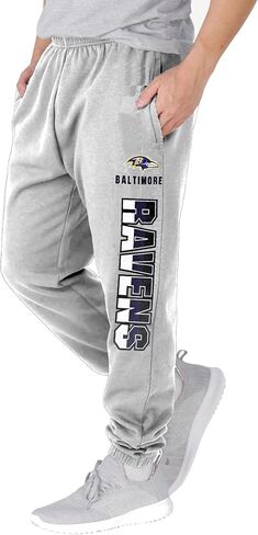 NFL Kids Youth 8-20 Officially Licensed Primary Team Logo Stripe Fleece Lined Football Sweatpants Joggers Pants in Saudi Arabia