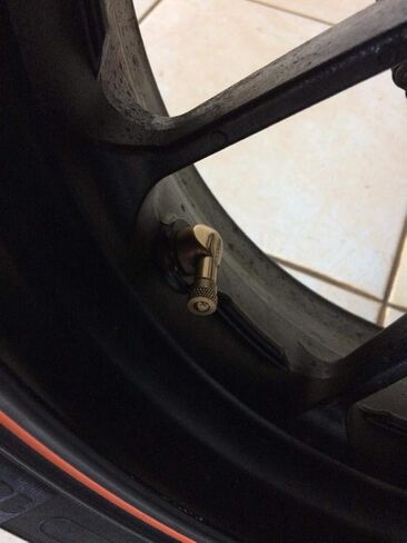Forged Alloy Angled Valve Stem with Pre-Applied Threadlocker Nut, 0.453in (11.3mm) Size, Orange in Saudi Arabia