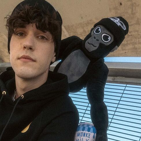 Official Monke Plush, Poseable Arms with Accessories: Backpack, Beanie & Milk Carton (18 Inch) in Saudi Arabia