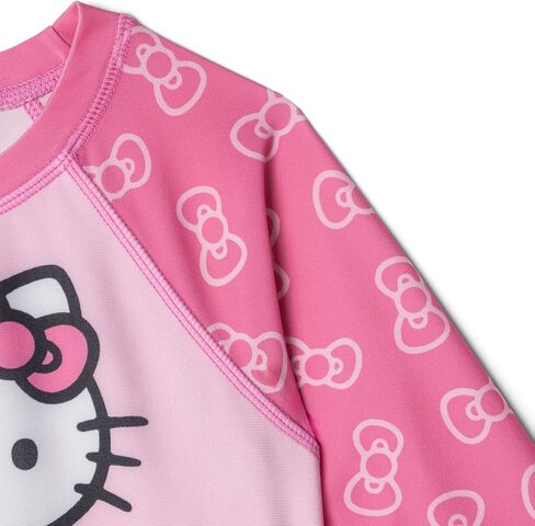 طقم سباحة Hello Kitty Girls Raglan Rash Guard وجزء سفلي بيكيني بعامل حماية من الأشعة فوق البنفسجية 50+، مقاسات الأطفال الصغار إلى الأطفال الكبار (5-14-16) in Kuwait