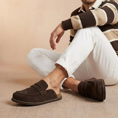 قباقيب من جلد الغزال بتصميم Wally Loafer للرجال من CUSHIONAIRE، أحذية رجالي سهلة الارتداء بدون ظهر للاستخدام الداخلي والخارجي مع وسادة قدم مبطنة in Kuwait