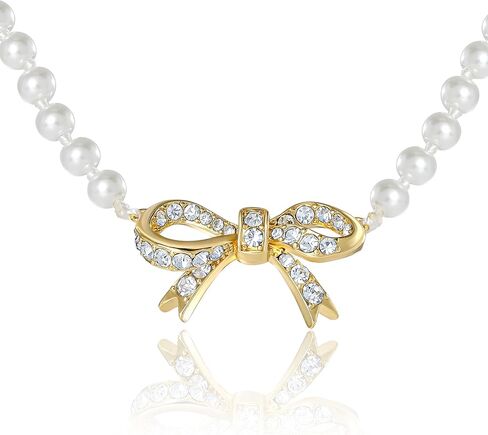 عقد من Juicy Couture مزين بفيونكة من اللؤلؤ الصناعي وأحجار شفافة، عقد بقلادة على شكل فيونكة ذهبية اللون مقاس 18 بوصة + 2 بوصة in Kuwait