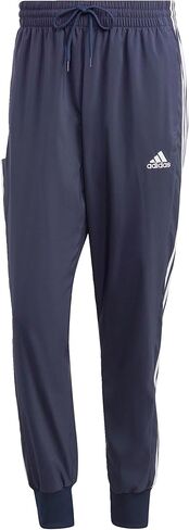 adidas Men's Athletics Essentials 3 Stripes Tapered Tricot Pant in Saudi Arabia