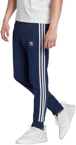 adidas Men's Athletics Essentials 3 Stripes Tapered Tricot Pant in Saudi Arabia