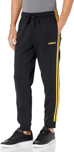 adidas Men's Athletics Essentials 3 Stripes Tapered Tricot Pant in Saudi Arabia