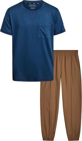 طقم بناطيل للأولاد من ريبوك - قطعتين تي شيرت بأكمام قصيرة وسروال رياضي منسوج بتقنية هايبرد - طقم ملابس ربيعية للأولاد (8-12) in Kuwait