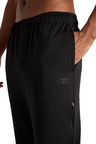 Reebok Men's Grind Tapered Oblong Pant, Standard Fit, 30" Inseam, Lightweight Stretch Poly Fabric in Saudi Arabia