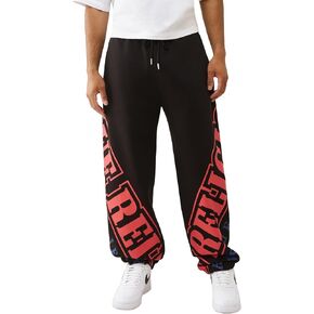 True Religion Overt Arch Logo Baggy Joggers for Men – Oversized Sweatpants with Drawstring Waist & Pockets in Saudi Arabia