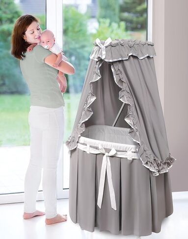 Badger Basket Majesty Canopy Bassinet, Rocking Baby Cradle Bed with Mattress, Bedding, and Storage, Oval White/Pink in Saudi Arabia