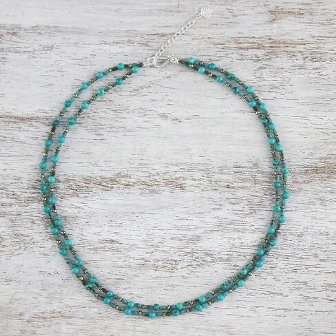 NOVICA Artisan قلادة مطرزة يدويًا من الكالسيت الفيروزي التايلاندية مع مشبك فضي من البيريت المعاد تشكيله متعدد الأحجار الكريمة باللون الأزرق التايلاندي [16.25 بوصة طول 8 مم عرض موسع 2 بوصة طول] ' in Saudi Arabia