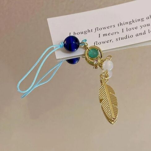 PUCAPOCO Wanderer Scaramouche سلسلة مفاتيح سحرية للهاتف Genshin Merch مستوحاة حلية هاتف حزام سلسلة مفاتيح ريش ذهبي in Kuwait