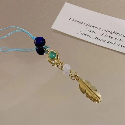 PUCAPOCO Wanderer Scaramouche سلسلة مفاتيح سحرية للهاتف Genshin Merch مستوحاة حلية هاتف حزام سلسلة مفاتيح ريش ذهبي in Kuwait