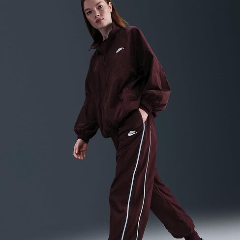 بنطال Nike Sportswear Windrunner المنسوج للنساء (بورجوندي كراش/أزرق سيليستين/شراع) in Kuwait