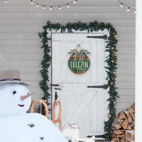Deroro Winter It's Freezin' Season Green Front Door Sign, Farmhouse Snowflake Wood Hanger Outdoor Outside Porch Decor, Rustic Christmas Wooden Wreath Indoor Wall Hanging Decoration with Plaid Bow in Saudi Arabia