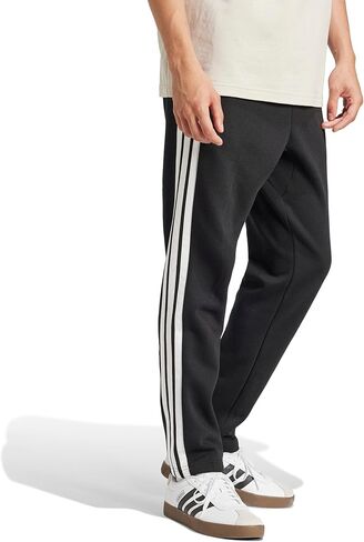 بنطال رجالي من Adidas Essentials 3-Stripes مصنوع من الصوف بحاشية مفتوحة، أسود/أبيض، كبير/طويل in Kuwait