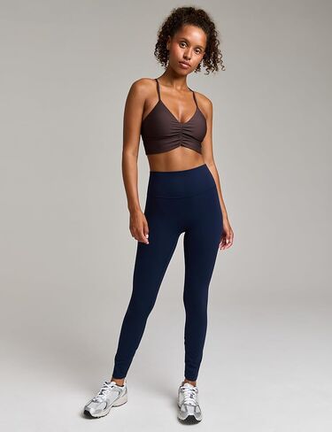 Women's Flow Scrunch Sports Bra V Neck Padded Yoga Tank Adjustable Straps Cross Back Crop Tops in Saudi Arabia